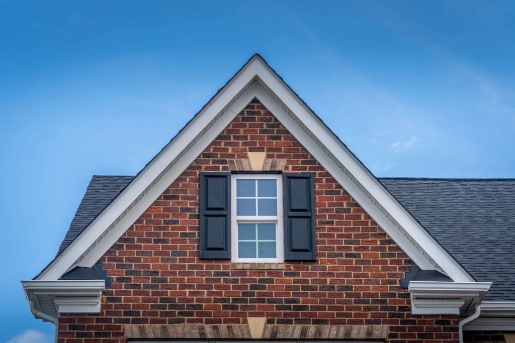 Gable roof with the triangular front.