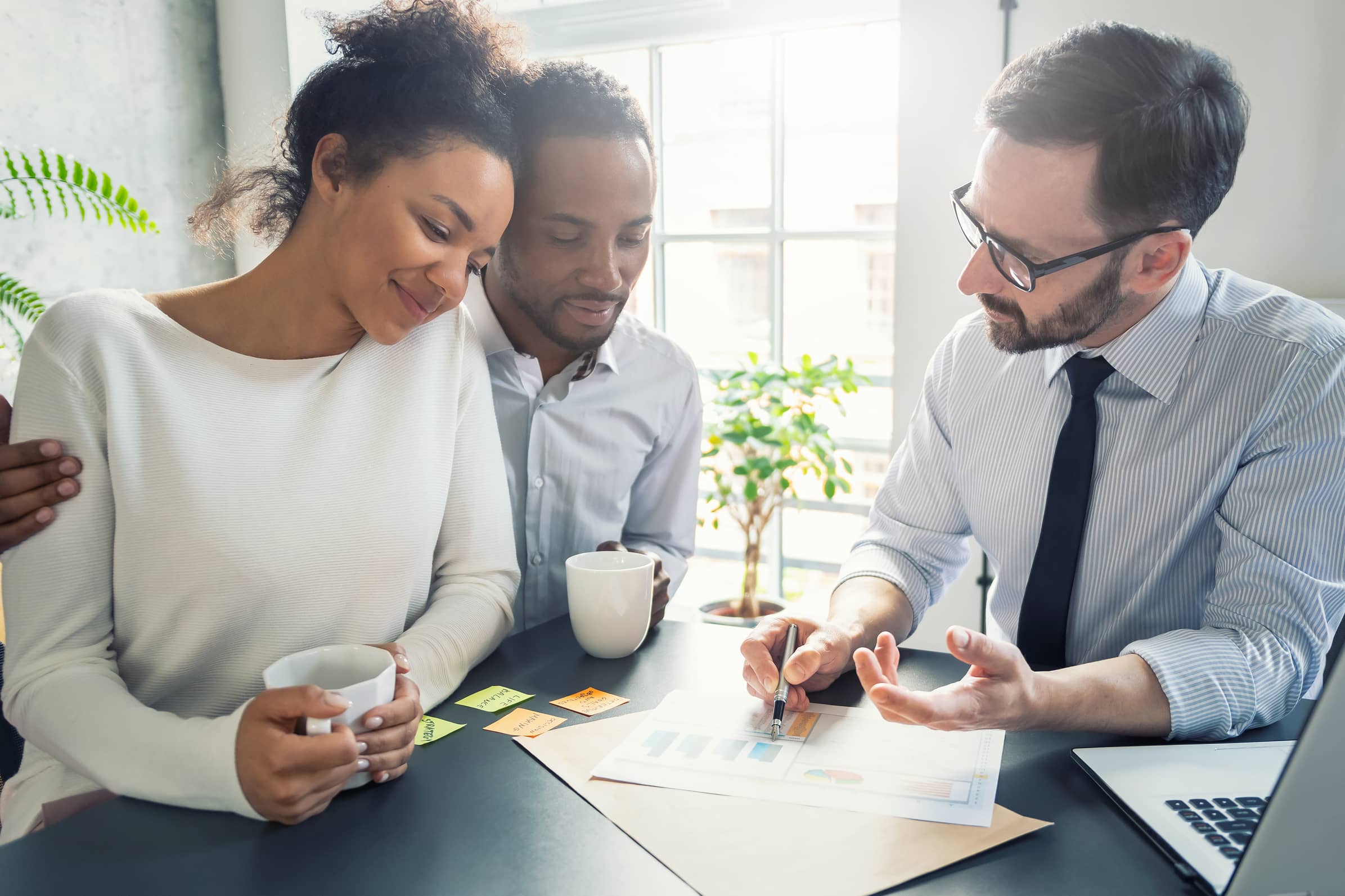 Realtor with clients post-purchase