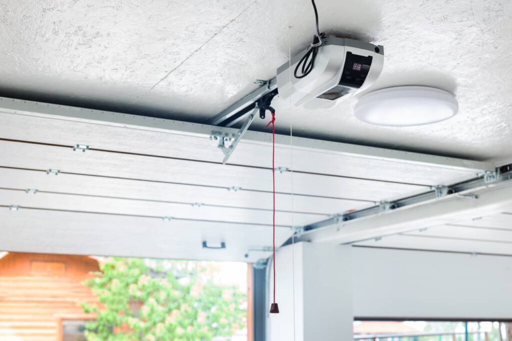 You can use the garage door emergency release cord to close a garage manually.