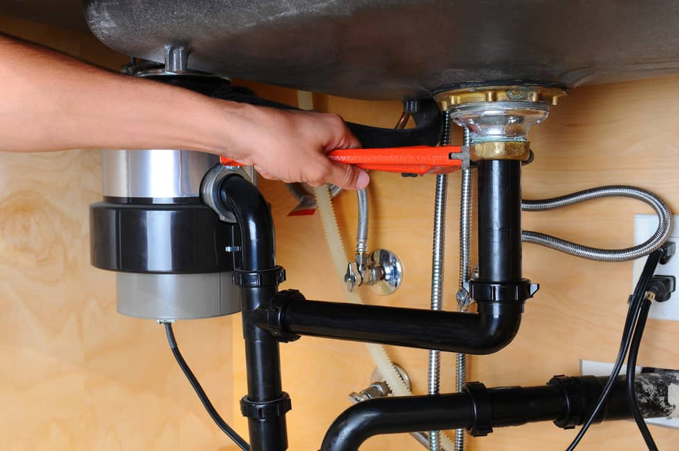 Maintenance on a garbage disposal.