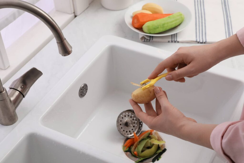 Vegetables can go in a 1/2 horsepower garbage disposal.